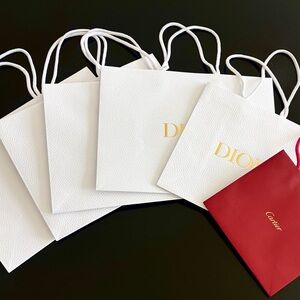 Bundle of Designer Shopping Bags Including Dior and Cartier Bags